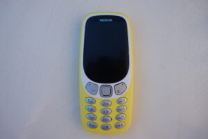 Yellow Nokia 3210 mobile phone