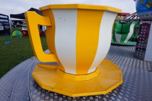 funfair ride yellow teacup