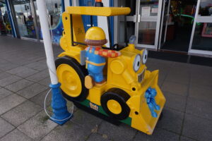 Yellow childrens ride bulldoser