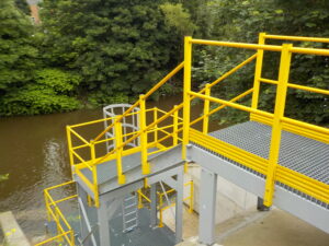 Yellow steps leading down to the river Irwell, Radcllife