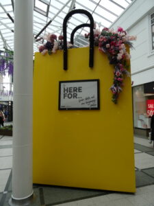 Big yellow hand bag in Stockport shopping centre