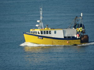 Yellow tug boat at Brixham
